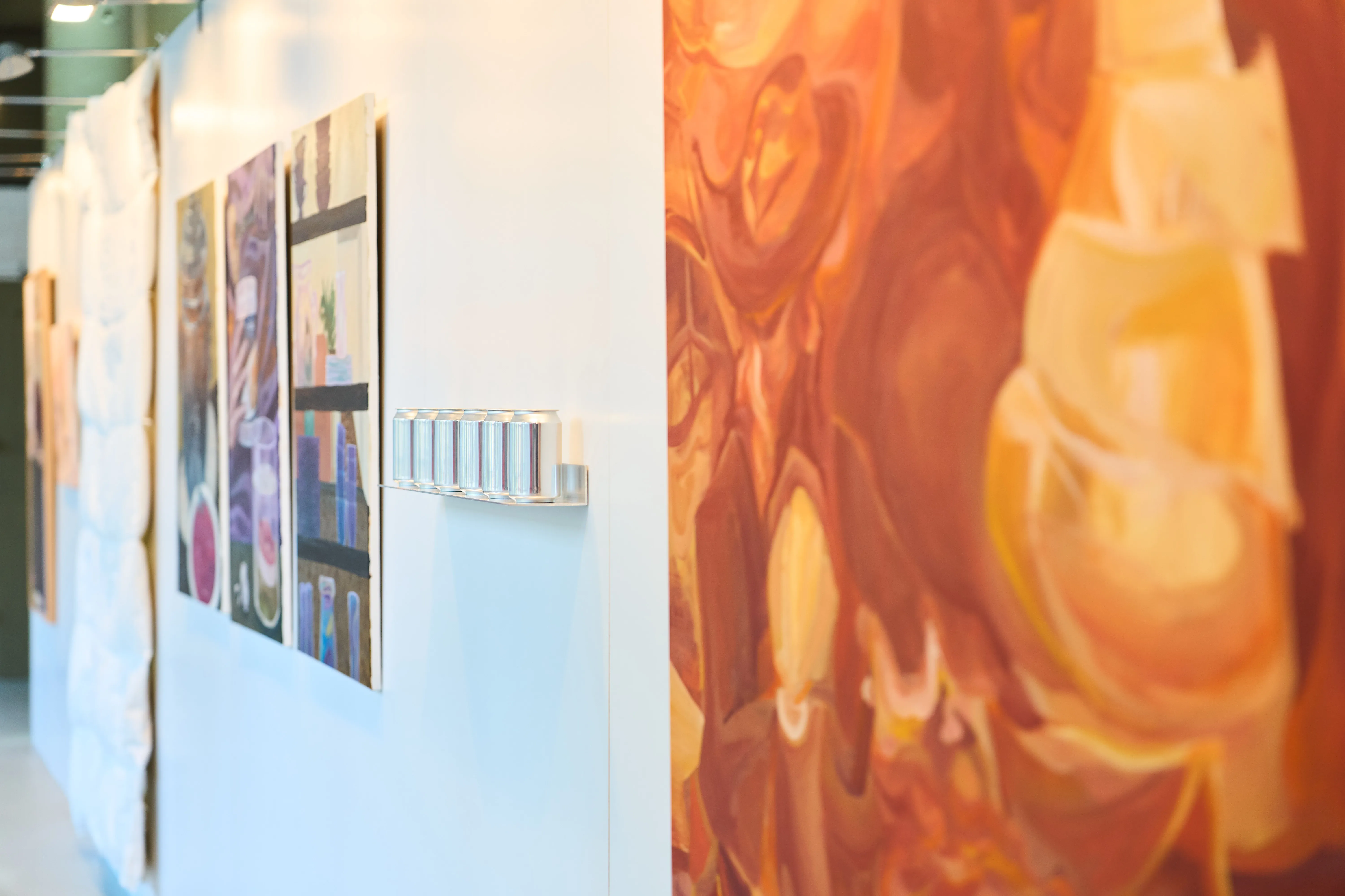 The photo shows a view of various works in an exhibition.